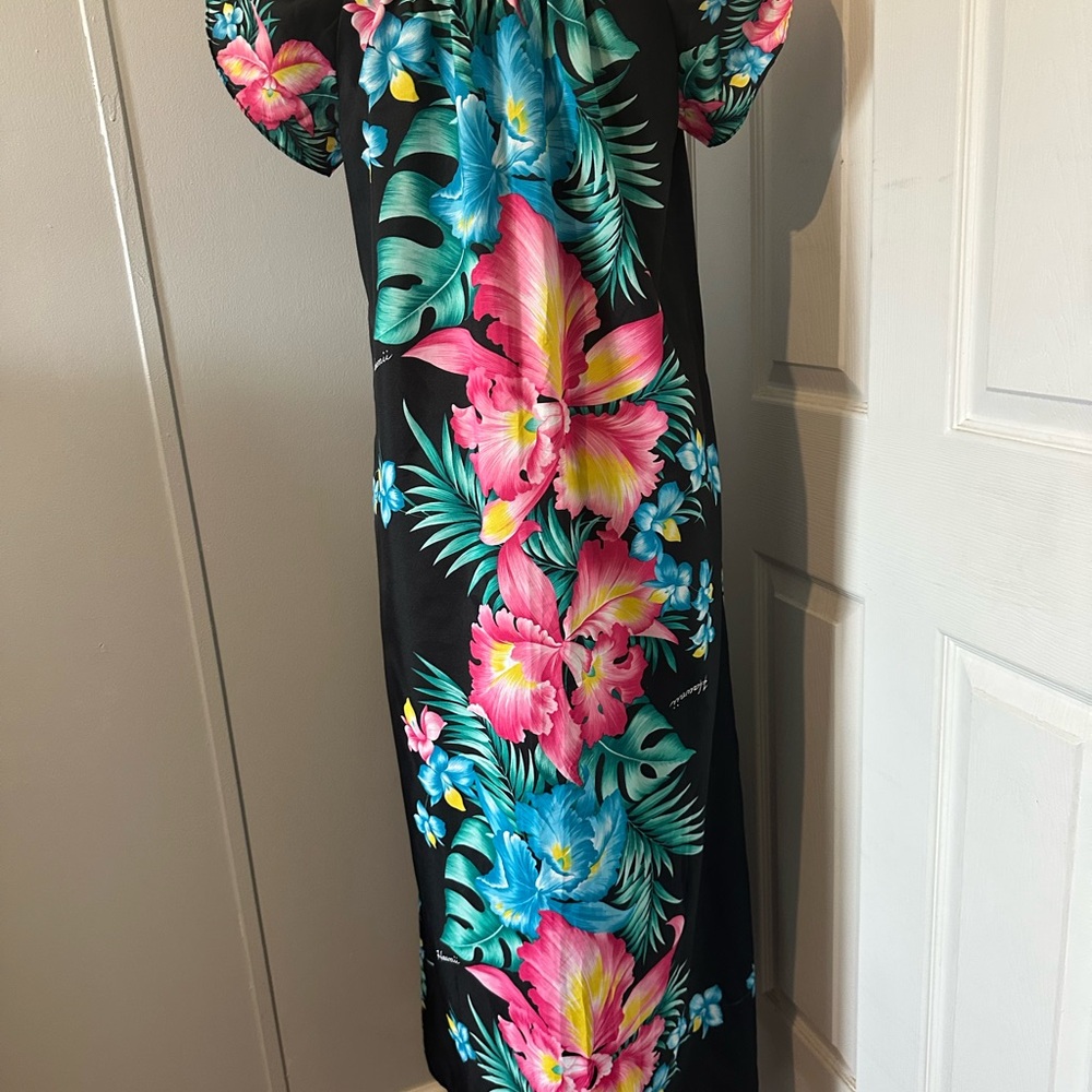 vintage Hawaiian muumuu, a traditional loose-fitting gown ,vibrant floral prints